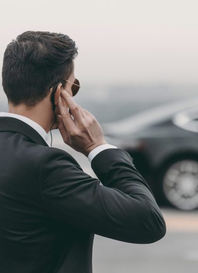 personal protection bodyguard standing and listening message scaled personal protection bodyguard standing and listening message scaled